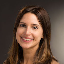 Woman with brown hair smiling