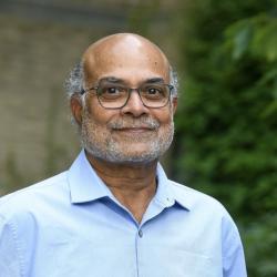 Man in blue shirt with beard