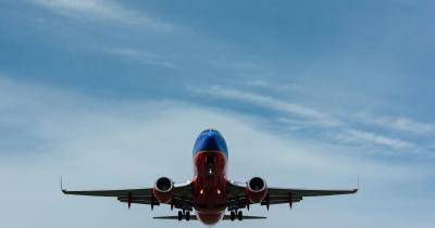 Airplane flying against clear sky