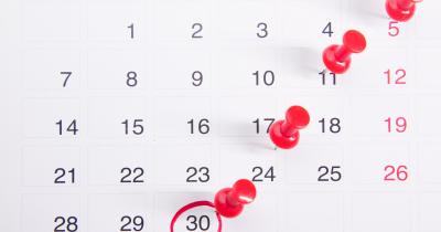 calendar with push pins in dates to show deadline